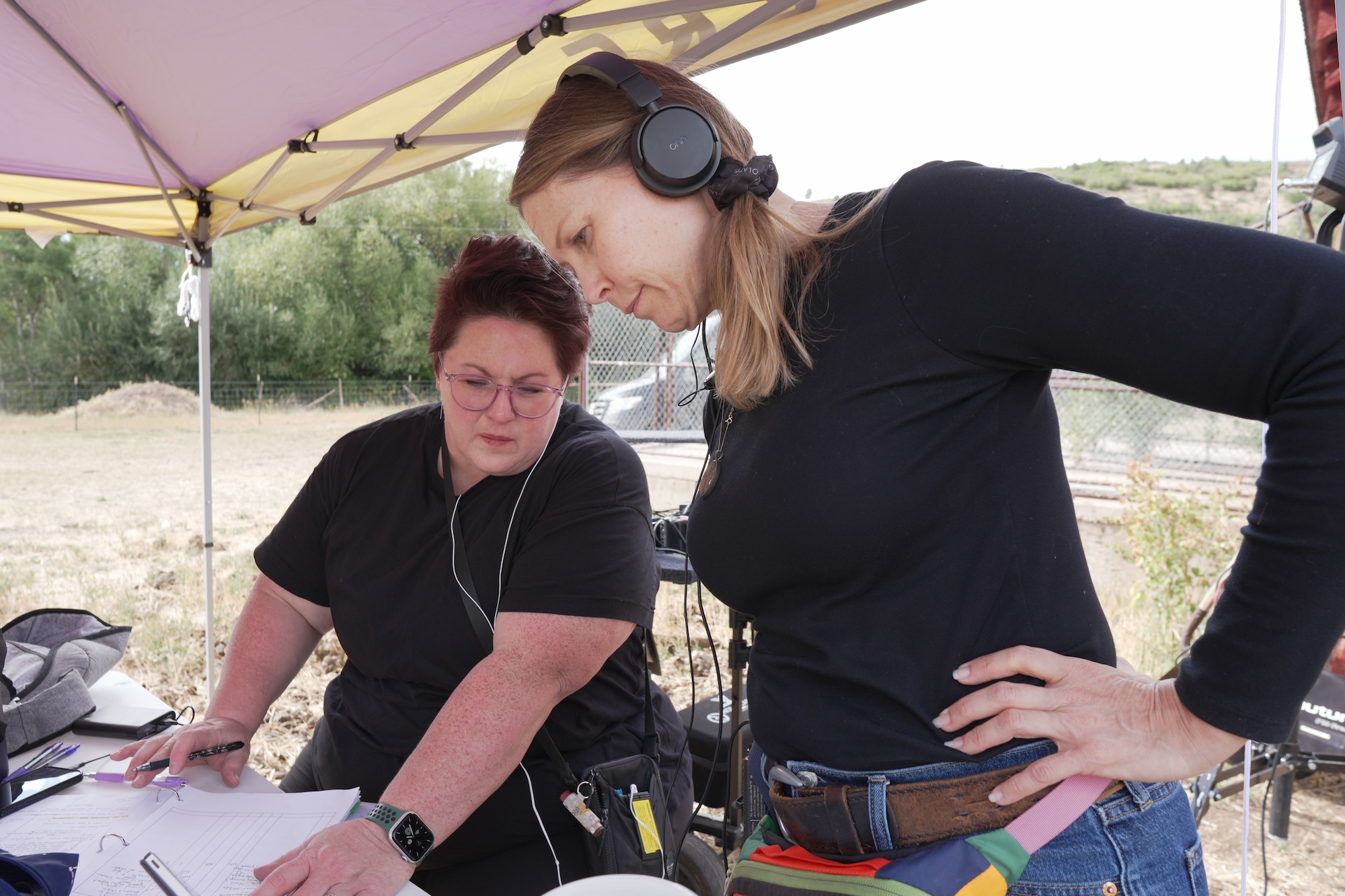 Script Supervisor Shelli Spotts and 1st AD Natalie Mathis watching a take